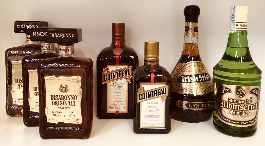 Samling af amaretto og likør (7 enheder) - herunder Disaronno Origonale amaretto 2 stk. 50cl og 1 stk.. 70cl, Cointreau 50cl og 100cl, Irsih Mist 100cl samt Aromes del Montserrat 70cl